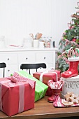 Christmas gifts, candy canes, gingerbread on kitchen table