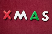 The word XMAS on red background