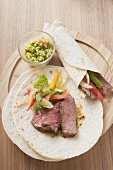 Wraps with beef and pepper filling, guacamole (Mexico)