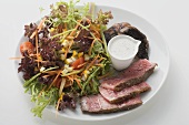 Steak salad with mushrooms and dressing