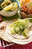 Wrap ingredients, salsa and guacamole (Mexico)