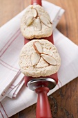 Almond biscuits on rolling pin