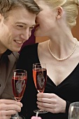Romantic couple with glasses of sparkling wine