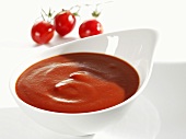 Tomato ketchup in white dish