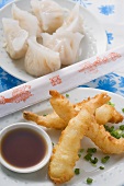 Dim sum & deep-fried prawns in batter with soy sauce (Asia)