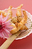 Deep-fried prawns in batter in straining spoon (Asia)