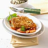 Breaded chicken breast with peanuts and carrots
