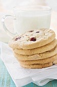 Cranberry cookies in front of a glass of milk