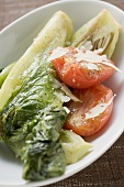 Braised romaine lettuce with tomatoes and Parmesan
