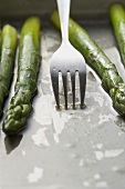 Roasted green asparagus with fork