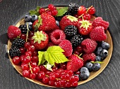 Assorted berries in wooden bowl