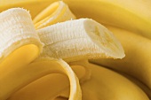 Fresh bananas, one half-peeled (close-up)