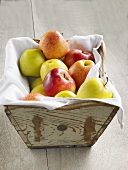 Fresh apples in a wooden basket