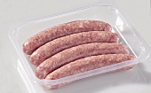 Four sausages in plastic container