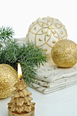 Gold candles and Christmas baubles