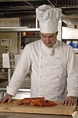 Chef with lobster in a commercial kitchen