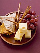 Cubes of cheese with grapes and nibbles