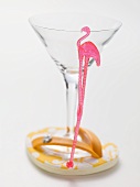 Empty cocktail glass with flamingo