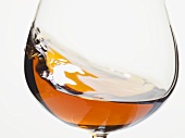 Cognac swirling in a glass