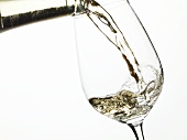 Pouring white wine into a glass