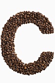 The letter C written in coffee beans