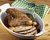 Roast veal studded with vegetables