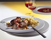 Bacon-wrapped rabbit fillet with pasta