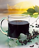 Elderberry syrup in a glass jug