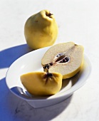 Whole and halved quince