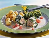 Savoy cabbage leaves with fish stuffing, potatoes, white wine sauce