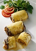 Aubergine rolls filled with minced beef and button mushrooms
