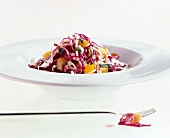 A plate of red and white cabbage salad