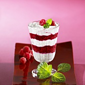 Layered raspberry and marzipan dessert in glass