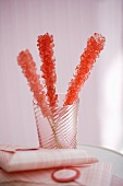 Three Pieces of Pink Rock Candy in a Glass