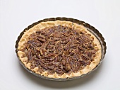 Whole pecan pie in the baking dish