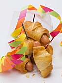 Sausage rolls with party decorations