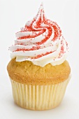 Cupcake with cream topping and red sugar