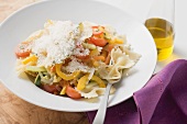 Farfalle primavera with vegetables and grated cheese
