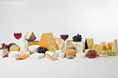 Cheese still life with wine, grapes and crackers