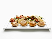 Fried scallops with vegetable salad and cheese