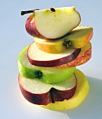 Slices of different apples, stacked