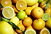 Whole and halved citrus fruit