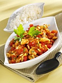 Turkey curry with tomatoes, almonds and rice