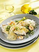 Coley and prawns with mustard sauce, cress and rice