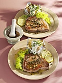 Tuna steaks with capers, coriander and baked potatoes