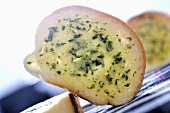 Slice of baguette with herb butter
