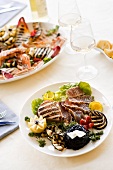 Grilled tuna steaks and vegetables