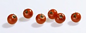 Several cherry tomatoes in a row