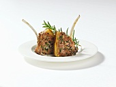 Lamb chops with herbs on plate