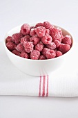 Frozen raspberries in bowl